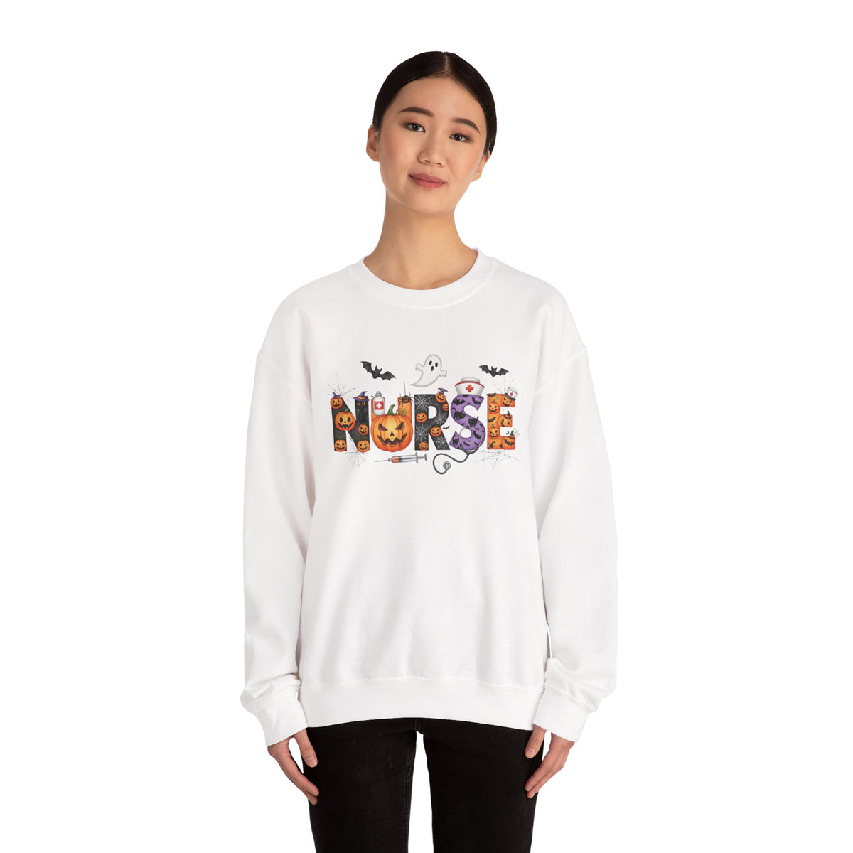 Woman wearing the white Halloween Nurse Pumpkin Sweatshirt, studio view