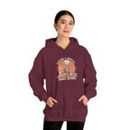 Woman wearing the Having A Mental Bake Down skeleton baker hoodie, hands in pocket