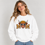 Woman wearing the White Highland Cow Mom Sunflower Leopard Sweatshirt with jeans