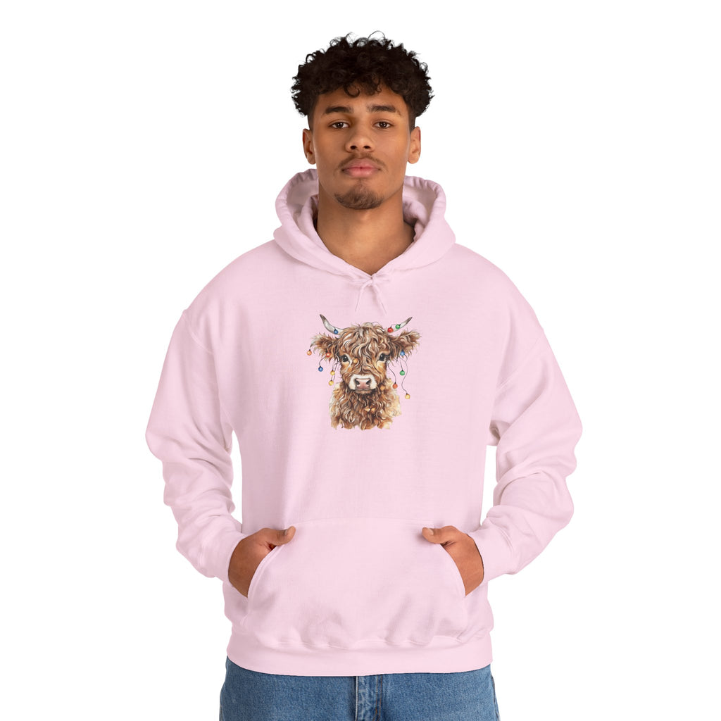 Man wearing the Light Pink Highland Cow With Christmas Lights Hoodie
