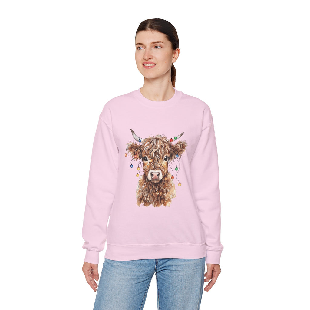 Woman wearing the Light Pink Highland Cow With Christmas Lights Sweatshirt