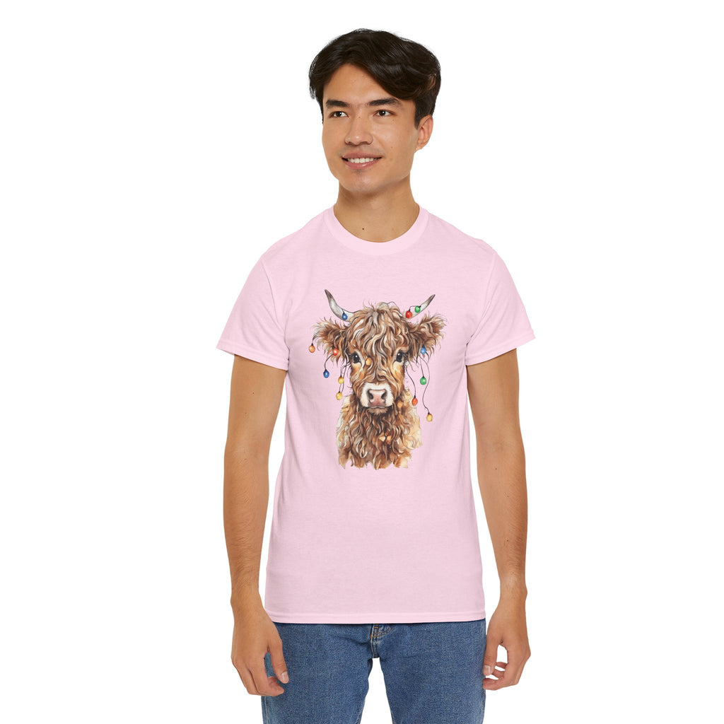 Man wearing the Light Pink Highland Cow With Christmas Lights T-Shirt