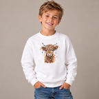 Boy wearing the White Highland Cow With Christmas Lights Youth Sweatshirt