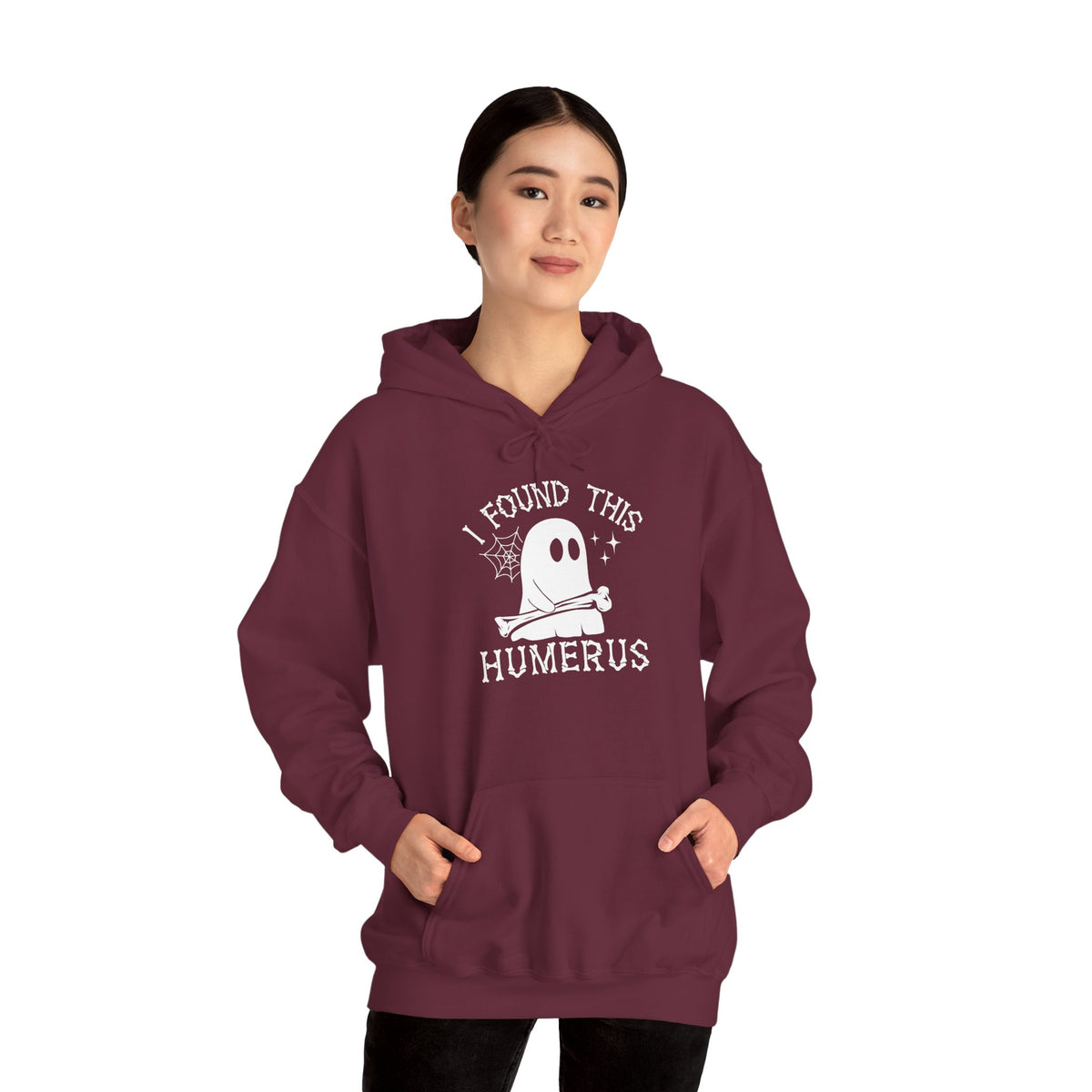 Woman wearing the I Found This Humerus ghost hoodie, front view