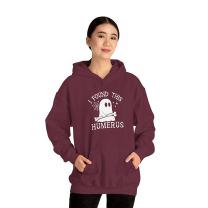 Woman wearing the I Found This Humerus ghost hoodie, front view