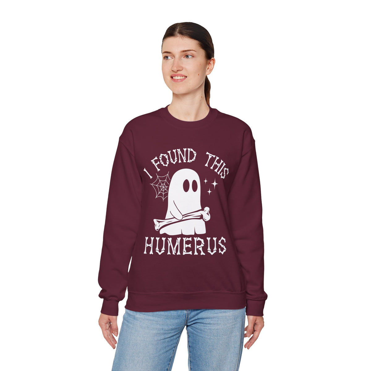 Woman wearing the I Found This Humerus ghost sweatshirt, front view