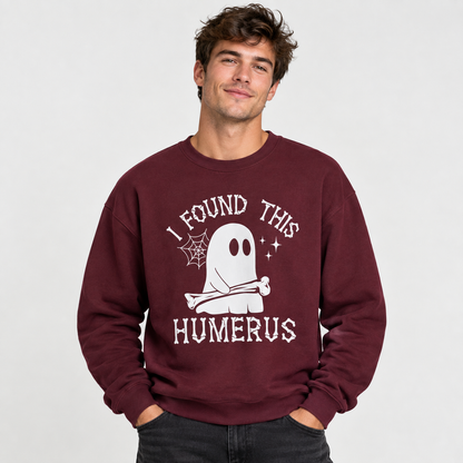 Man wearing the I Found This Humerus ghost sweatshirt, hands in pocket