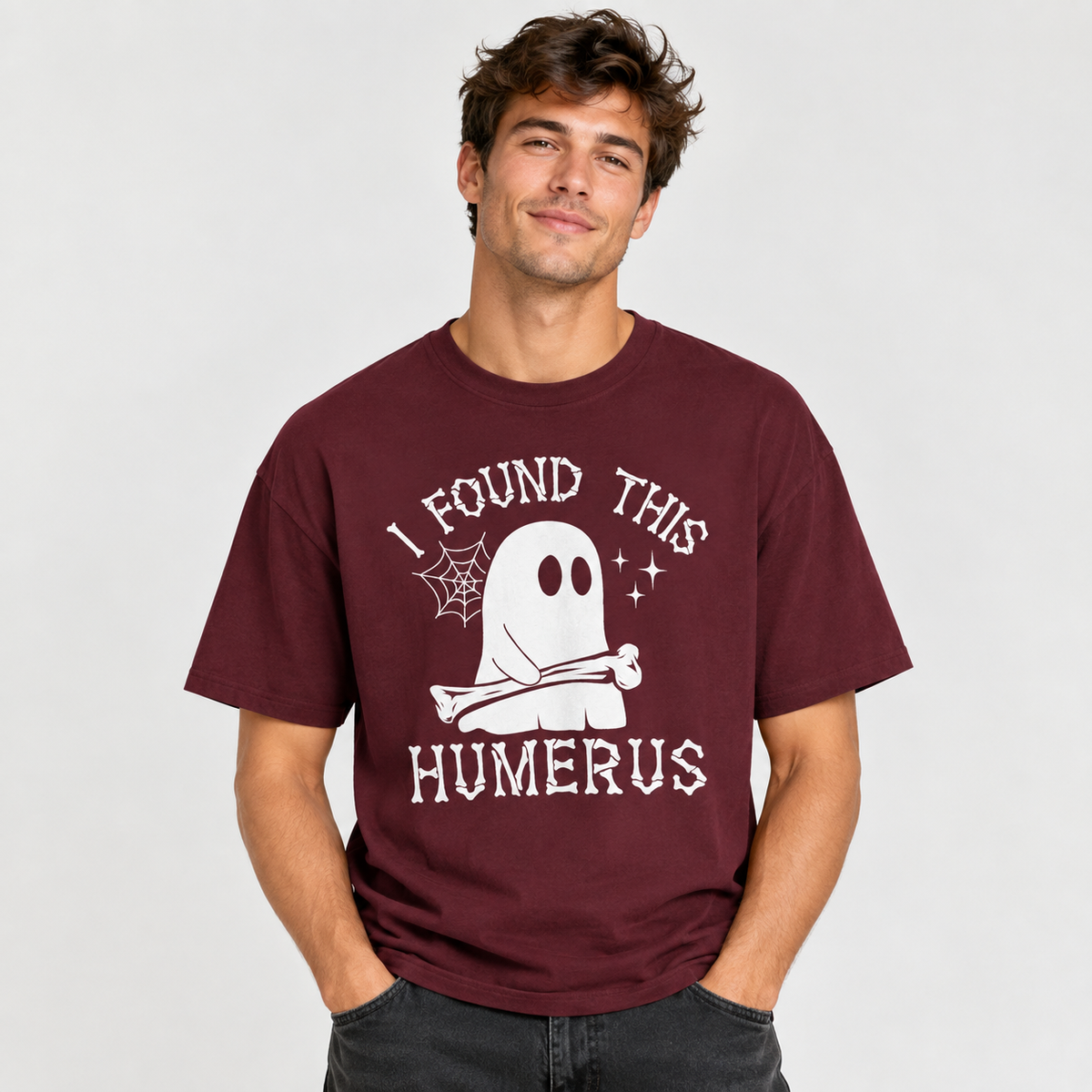 Man wearing the I Found This Humerus ghost t-shirt, hands in pocket
