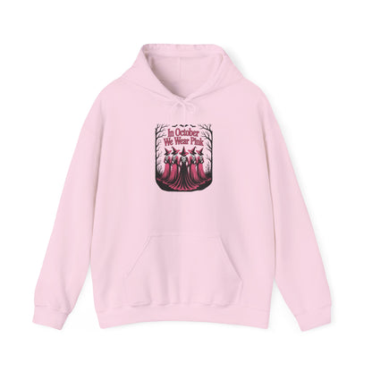 Light pink In October We Wear Pink hoodie with five witches in pink gowns