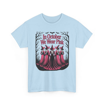Light blue In October We Wear Pink t-shirt with five witches in pink gowns