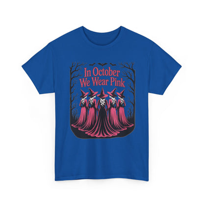 Royal blue In October We Wear Pink t-shirt with five witches in pink gowns