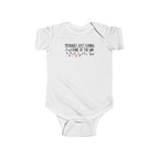 White Jingle Some Of The Way baby bodysuit with Christmas lights and a tired holiday slogan, front view