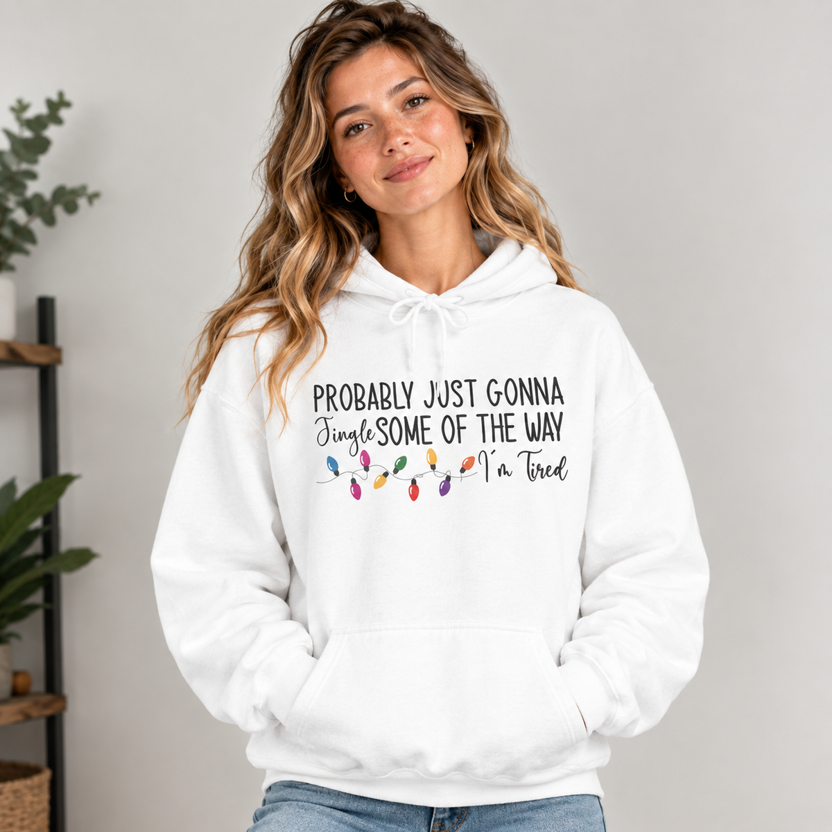 Woman wearing the White Jingle Some Of The Way Funny Christmas Hoodie with jeans