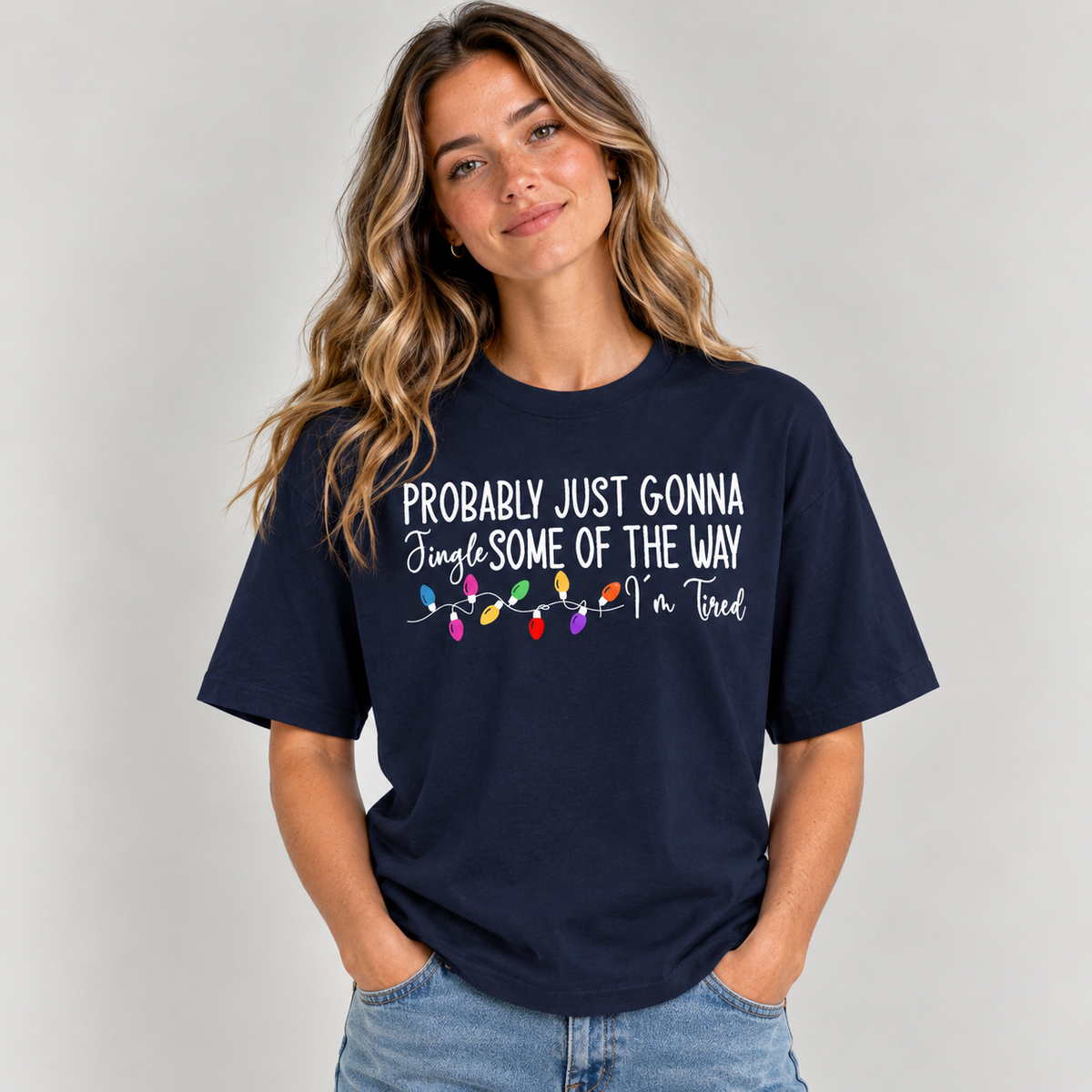 Woman wearing the Navy Jingle Some Of The Way Funny Christmas T-Shirt with jeans