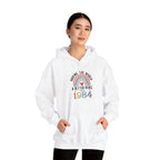 Man wearing the Making The World A Better Place Since 1984 rainbow hoodie