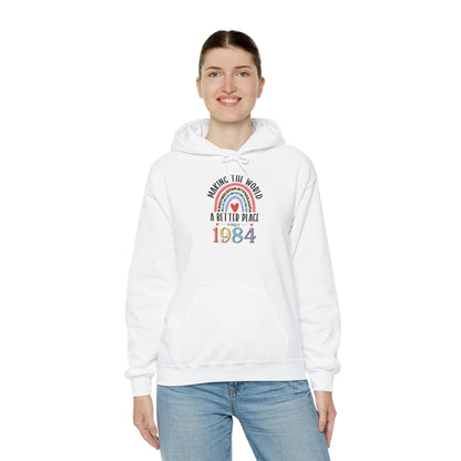 Woman wearing the Making The World A Better Place Since 1984 rainbow hoodie