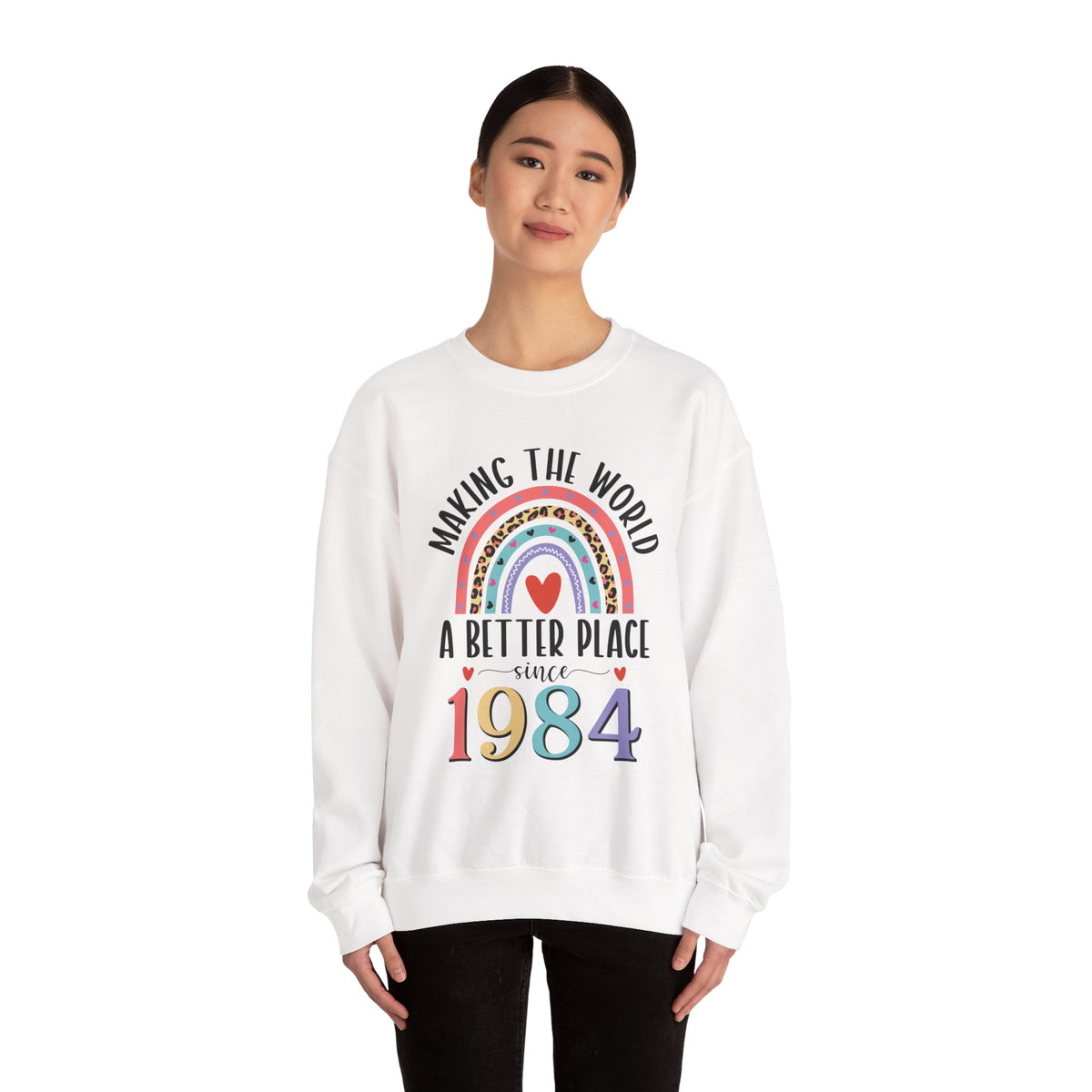 Woman wearing the White Making The World A Better Place Since 1984 rainbow sweatshirt, front view