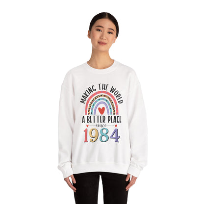 Woman wearing the White Making The World A Better Place Since 1984 rainbow sweatshirt, front view