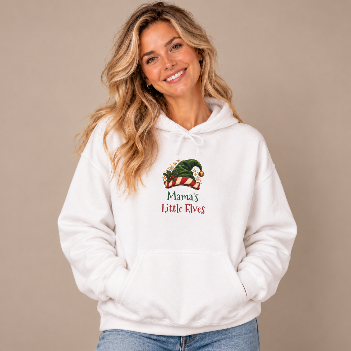 Woman wearing the White Mama's Little Elves Hoodie with jeans