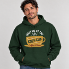 Man wearing the Forest Green Meet Me At The Cozy Cup Hoodie with jeans