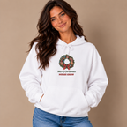 Woman wearing the White Merry Christmas Nurse Crew Hoodie with jeans