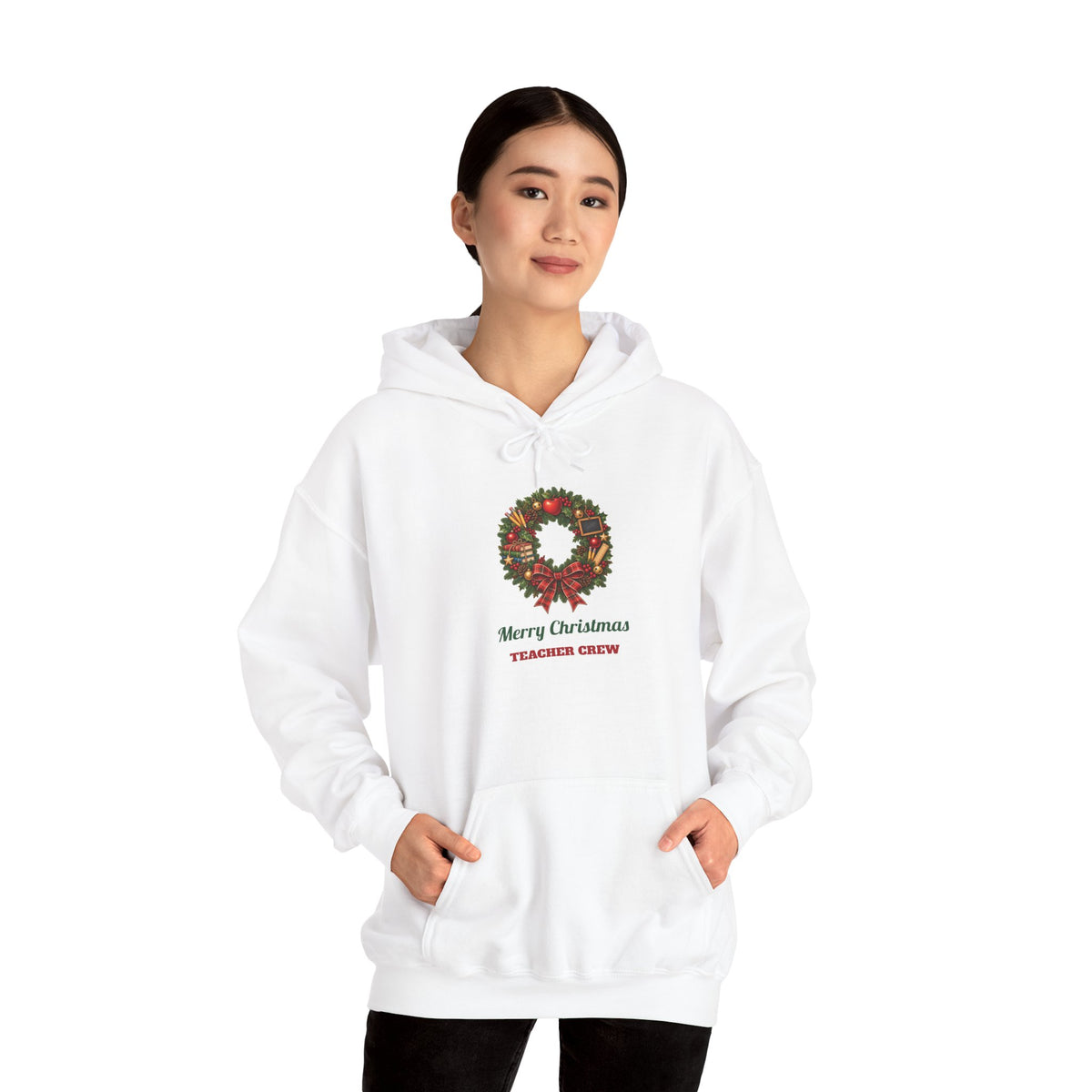 Woman wearing the Merry Christmas Teacher Crew Hoodie
