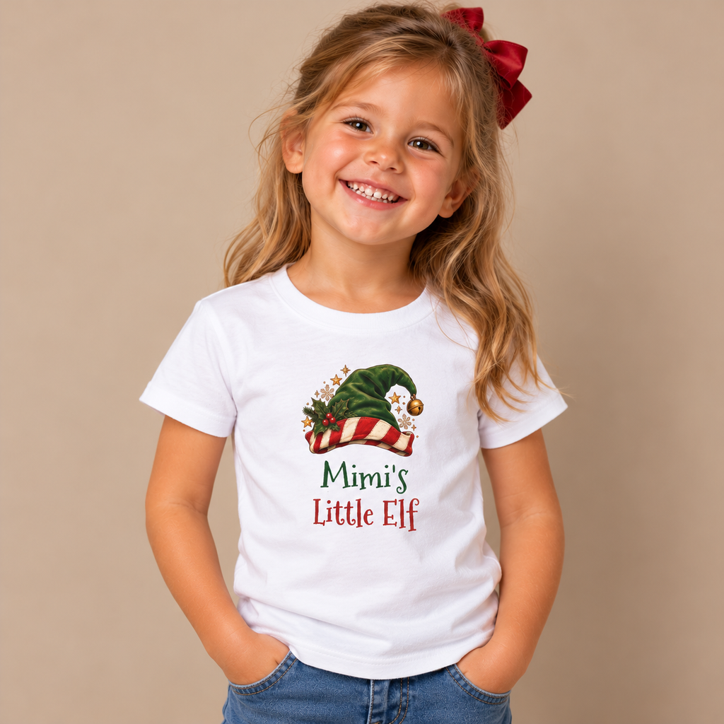 Girl wearing the White Mimi's Little Elf Kids T-Shirt