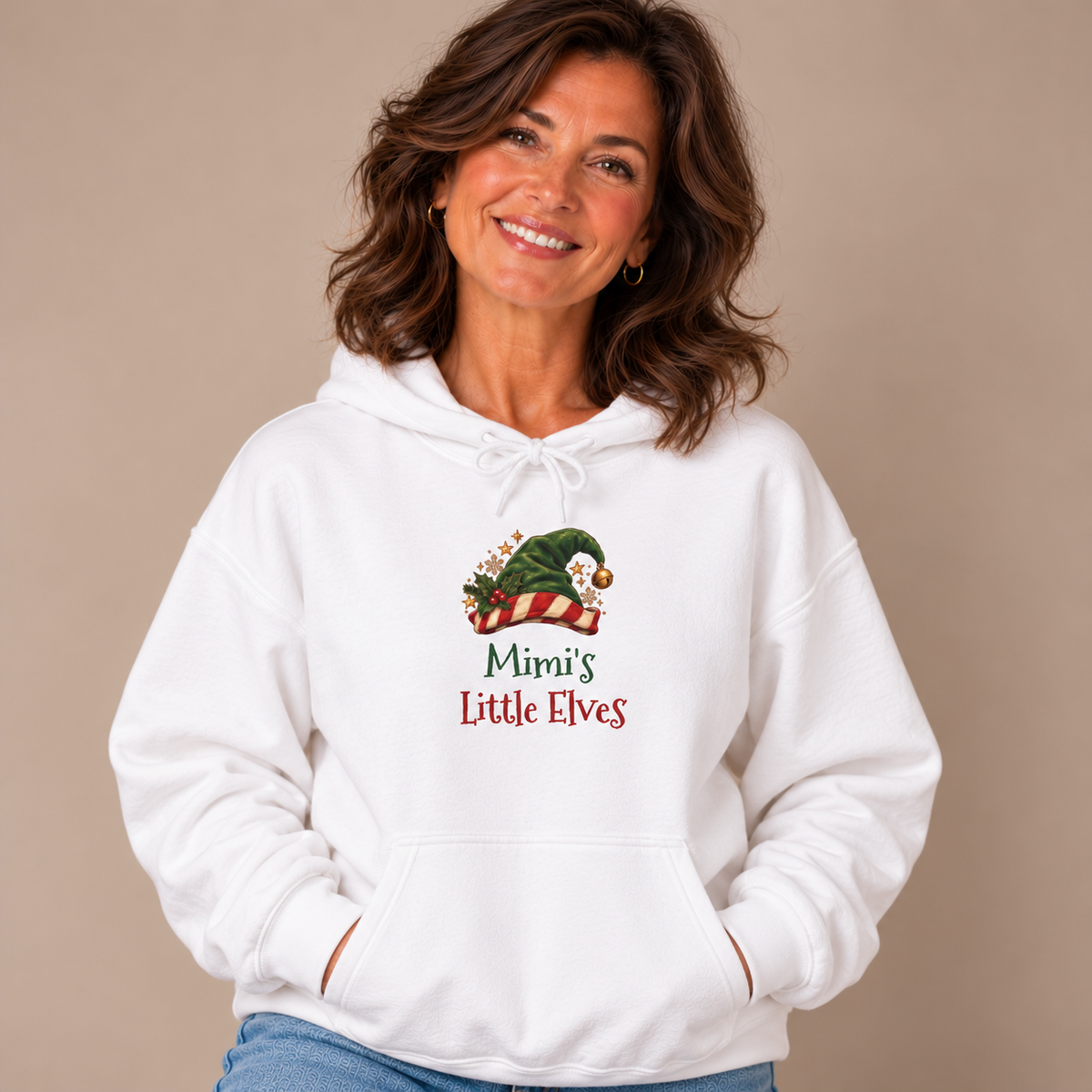 Woman wearing the White Mimi's Little Elves Hoodie with jeans