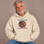 Man wearing the Sand My Favorite Veteran Calls Me Grandpa Hoodie with jeans