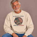 Man wearing the Sand My Favorite Veteran Calls Me Grandpa Sweatshirt with jeans