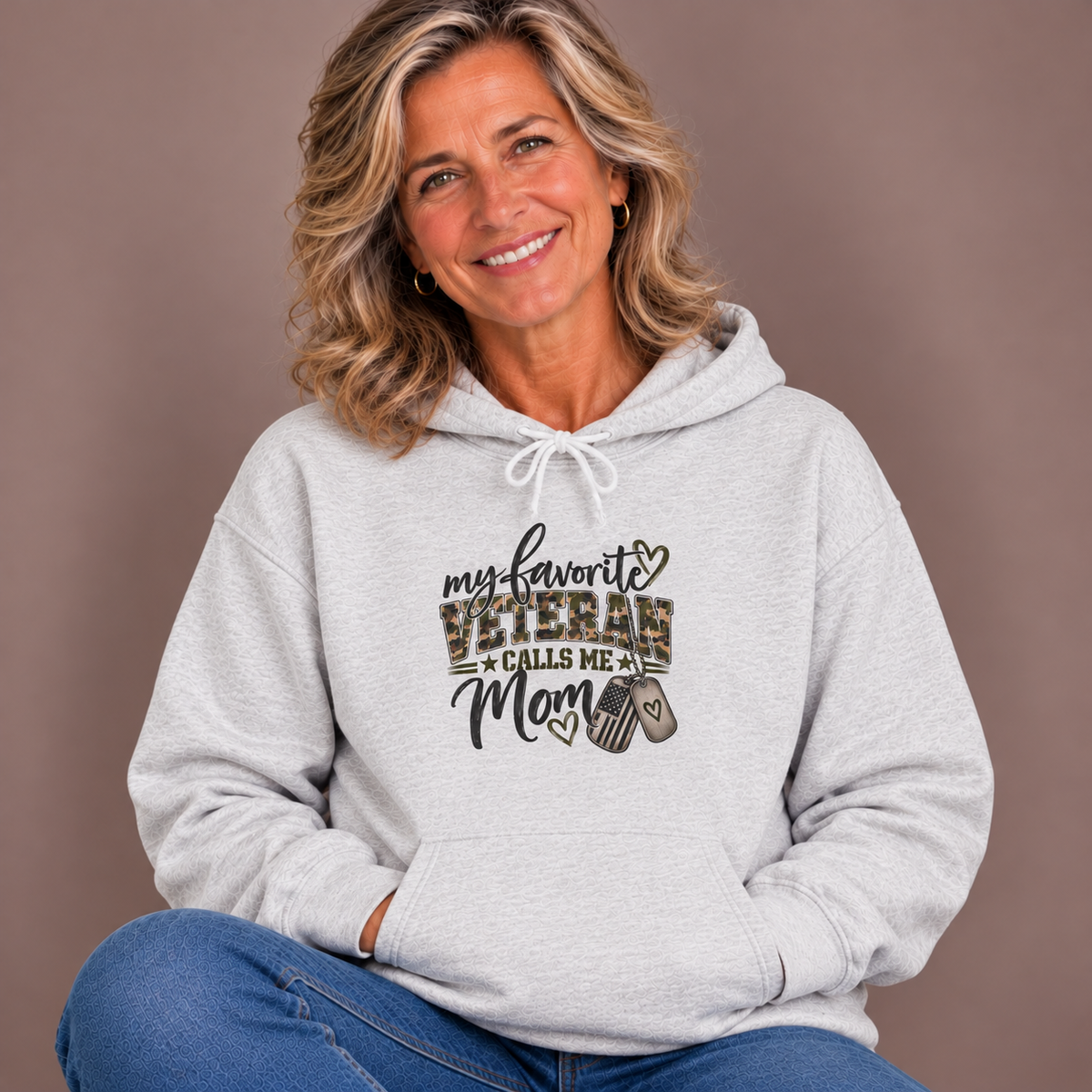 Woman wearing the Ash My Favorite Veteran Calls Me Mom Hoodie with jeans