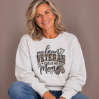 Woman wearing the Ash My Favorite Veteran Calls Me Mom Sweatshirt with jeans