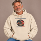 Man wearing the Sand My Favorite Veteran Calls Me Papa Hoodie with jeans