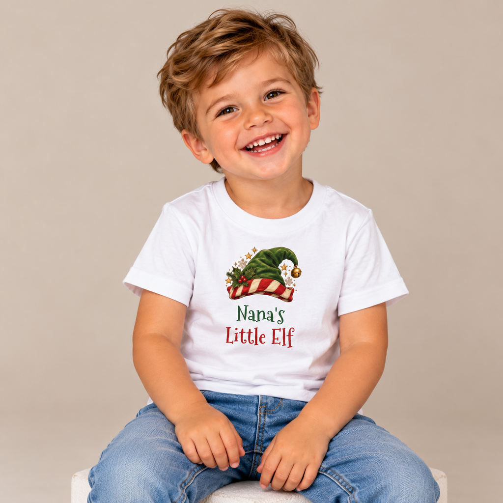Boy wearing the White Nana's Little Elf Toddler T-Shirt