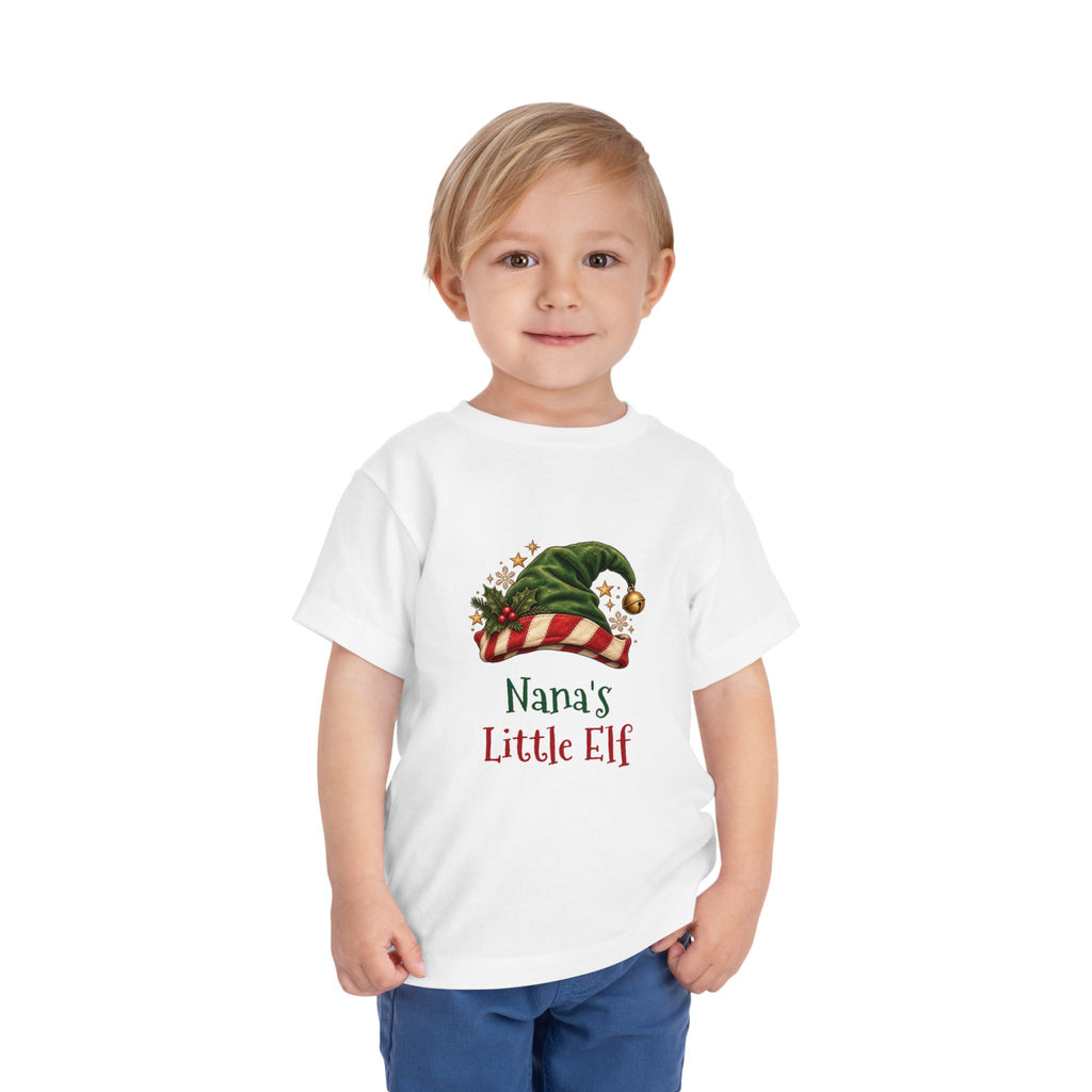Boy wearing the Nana's Little Elf Toddler T-Shirt