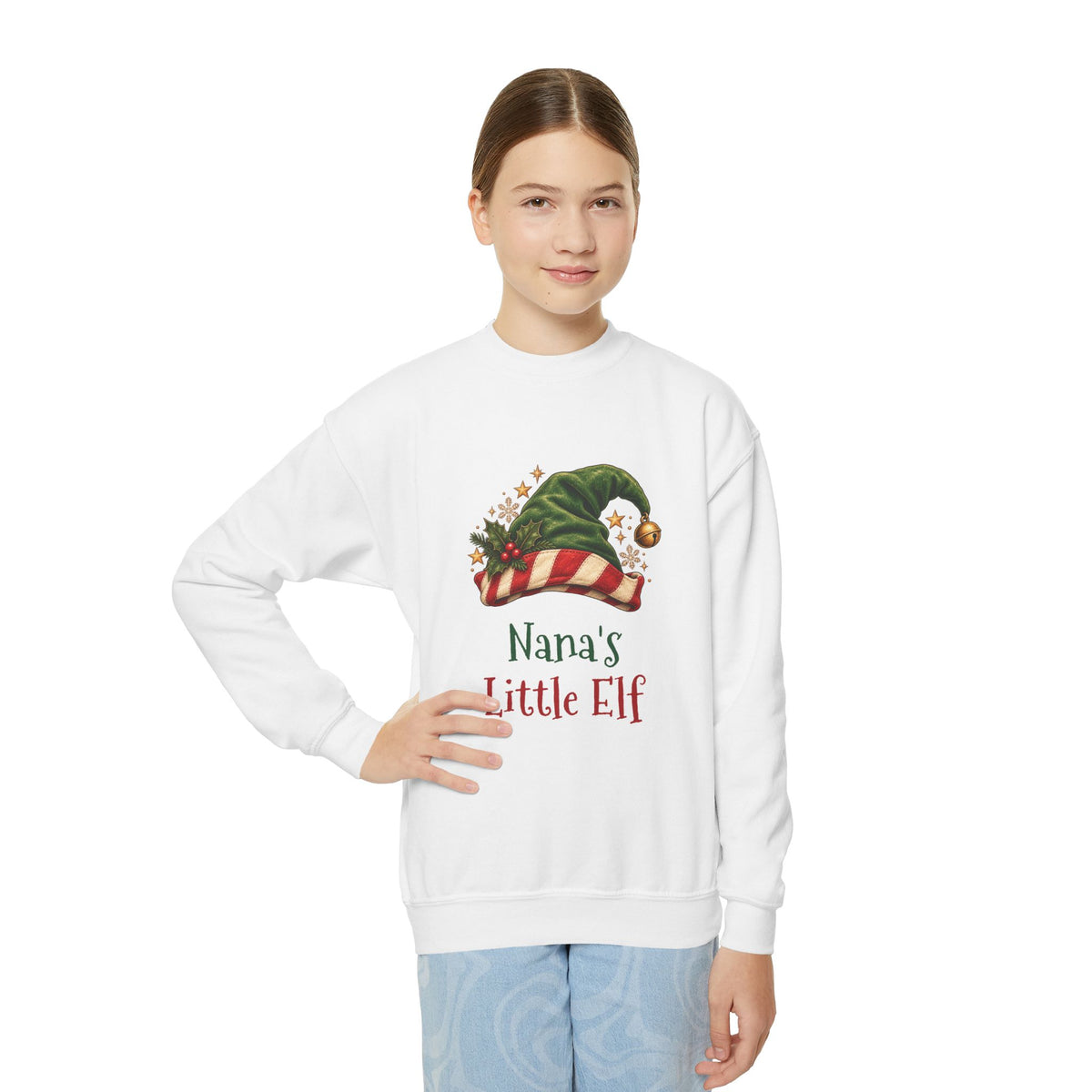 Girl wearing the Nana's Little Elf Youth Sweatshirt