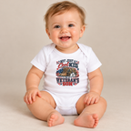 Baby wearing the White Not Just A Cool Kid I'm A Veteran's Son Baby Bodysuit
