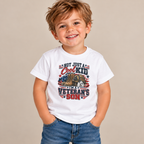 Toddler wearing the White Not Just A Cool Kid I'm A Veteran's Son Toddler T-Shirt with jeans