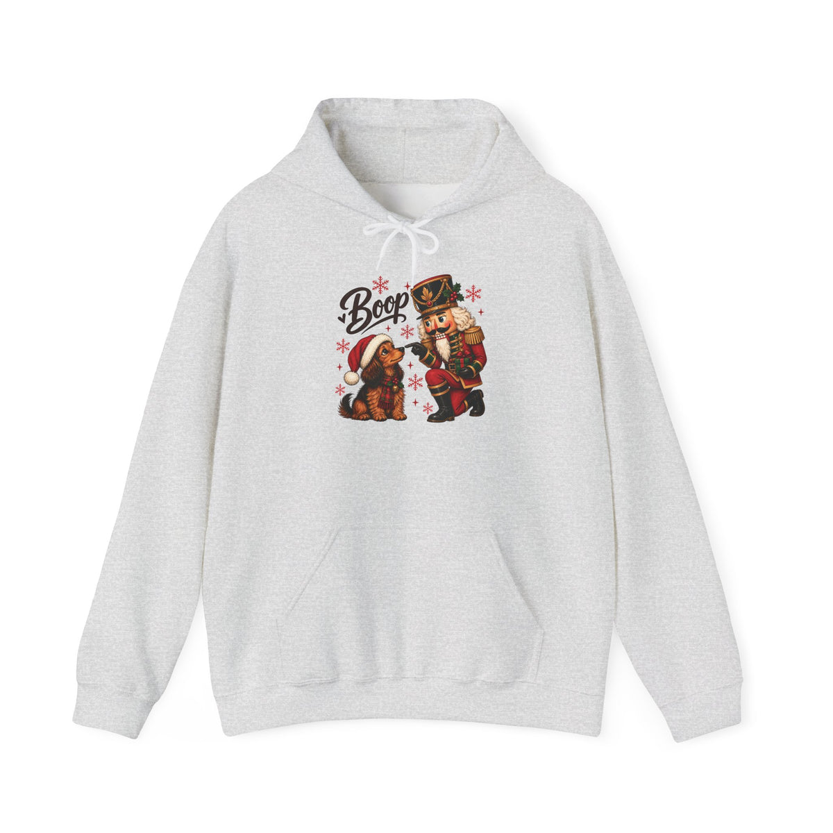 Ash Nutcracker Dachshund Boop Christmas hoodie with a nutcracker soldier booping the nose of a dachshund in a Santa hat, front view