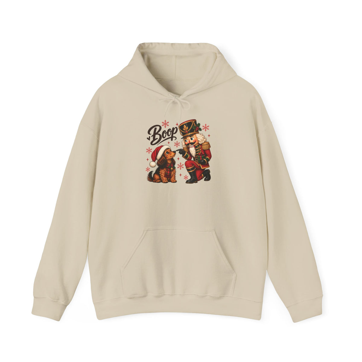 Sand Nutcracker Dachshund Boop Christmas hoodie with a nutcracker soldier booping the nose of a dachshund in a Santa hat, front view