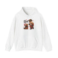 White Nutcracker Dachshund Boop Christmas hoodie with a nutcracker soldier booping the nose of a dachshund in a Santa hat, front view