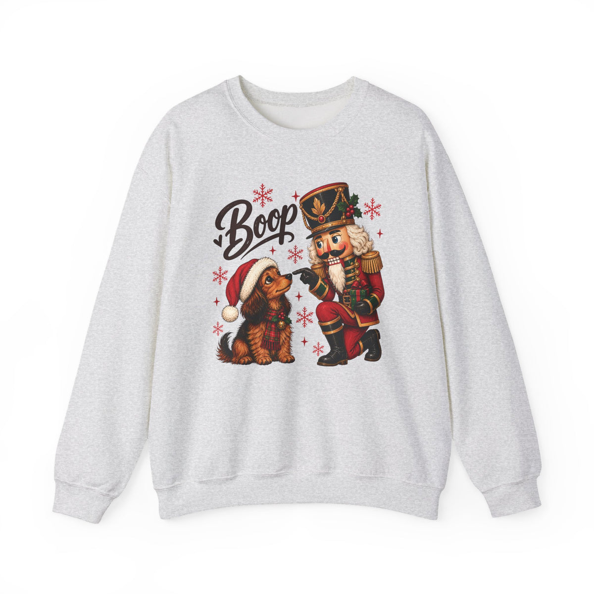 Ash Nutcracker Dachshund Boop Christmas sweatshirt with a nutcracker soldier booping the nose of a dachshund in a Santa hat, front view