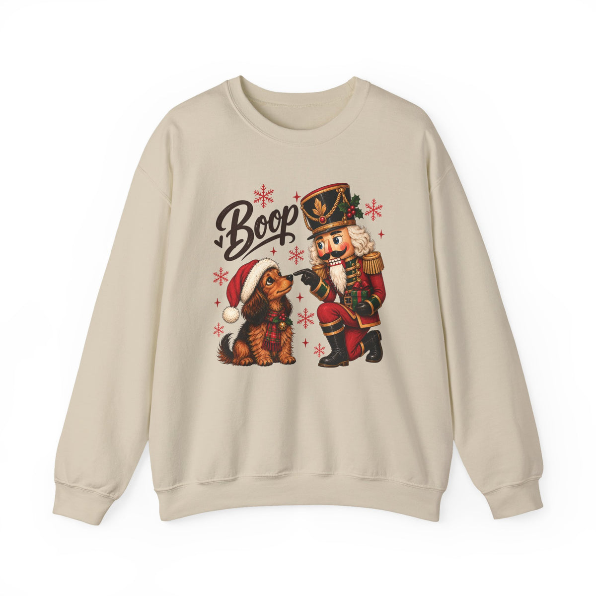 Sand Nutcracker Dachshund Boop Christmas sweatshirt with a nutcracker soldier booping the nose of a dachshund in a Santa hat, front view