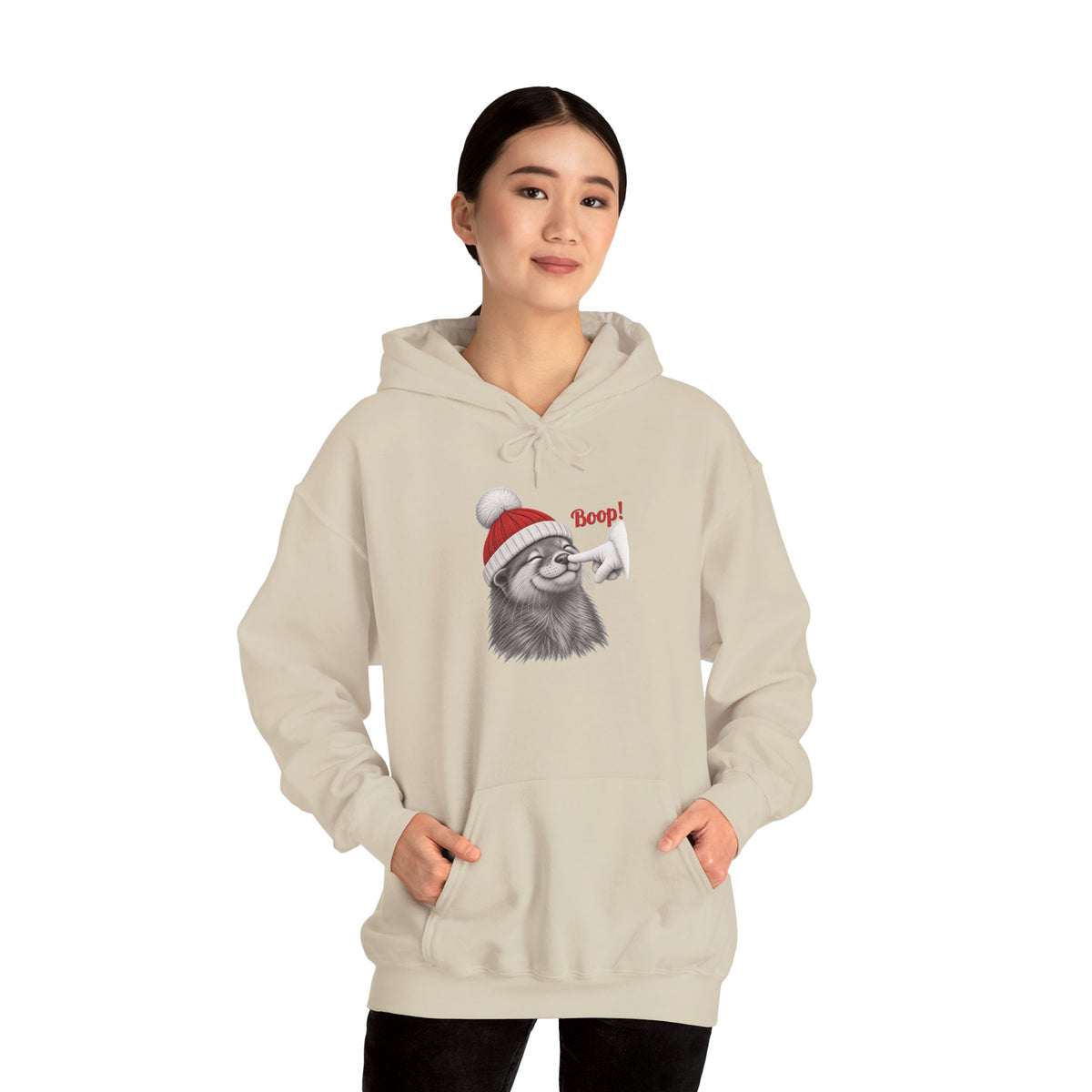 Model wearing the sand Otter Boop Christmas Hoodie