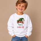 Boy wearing the White Papa's Little Elf Youth Sweatshirt