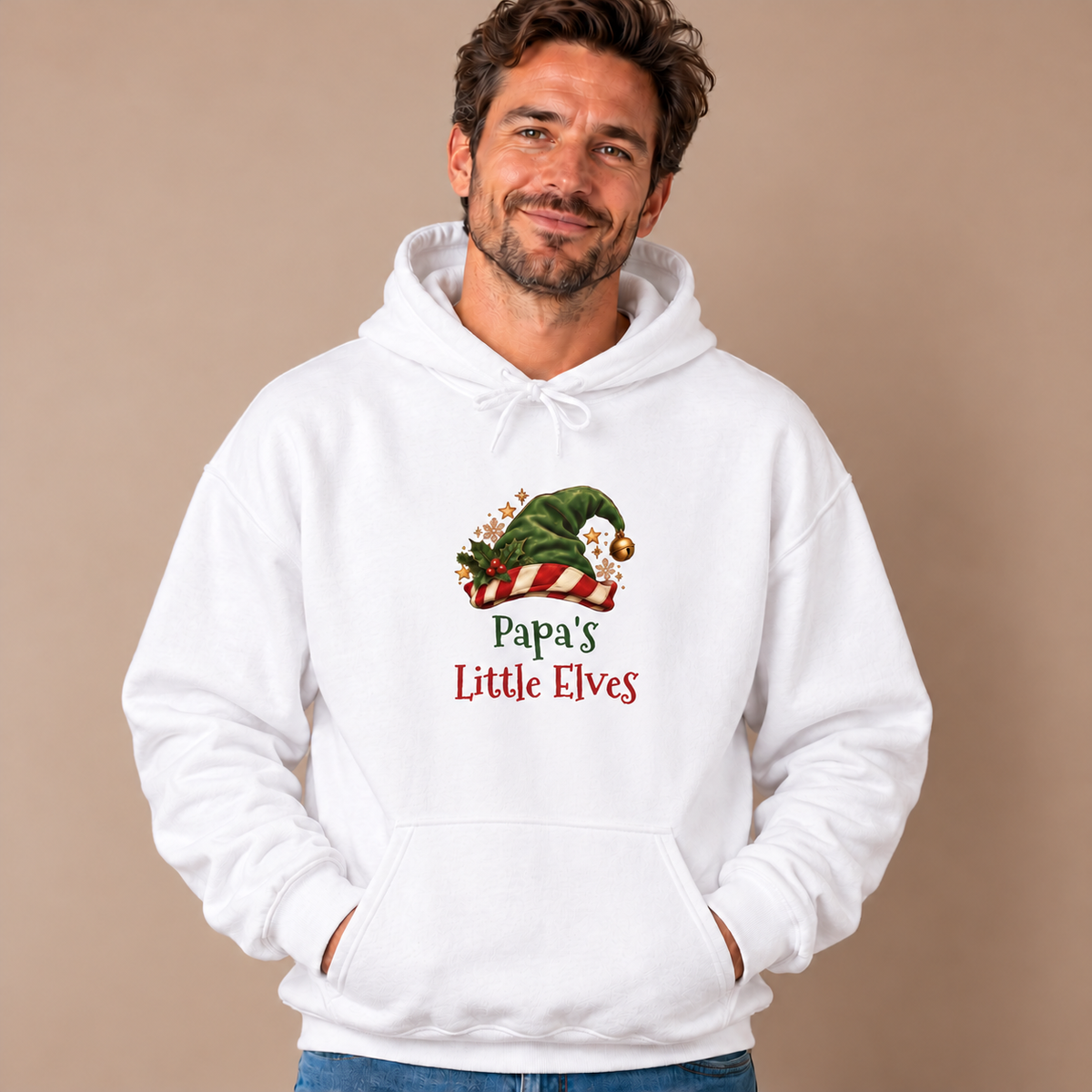 Man wearing the White Papa's Little Elves Hoodie with jeans