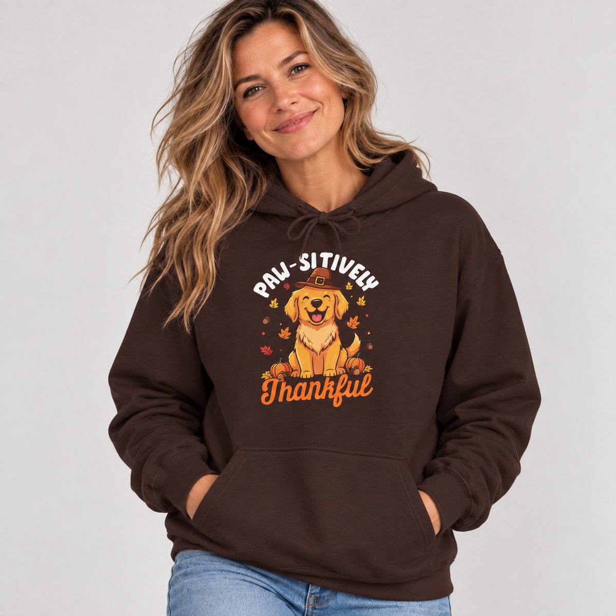 Woman wearing the Dark Chocolate Paw-sitively Thankful Hoodie with jeans