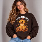 Woman wearing the Dark Chocolate Paw-sitively Thankful Sweatshirt with jeans