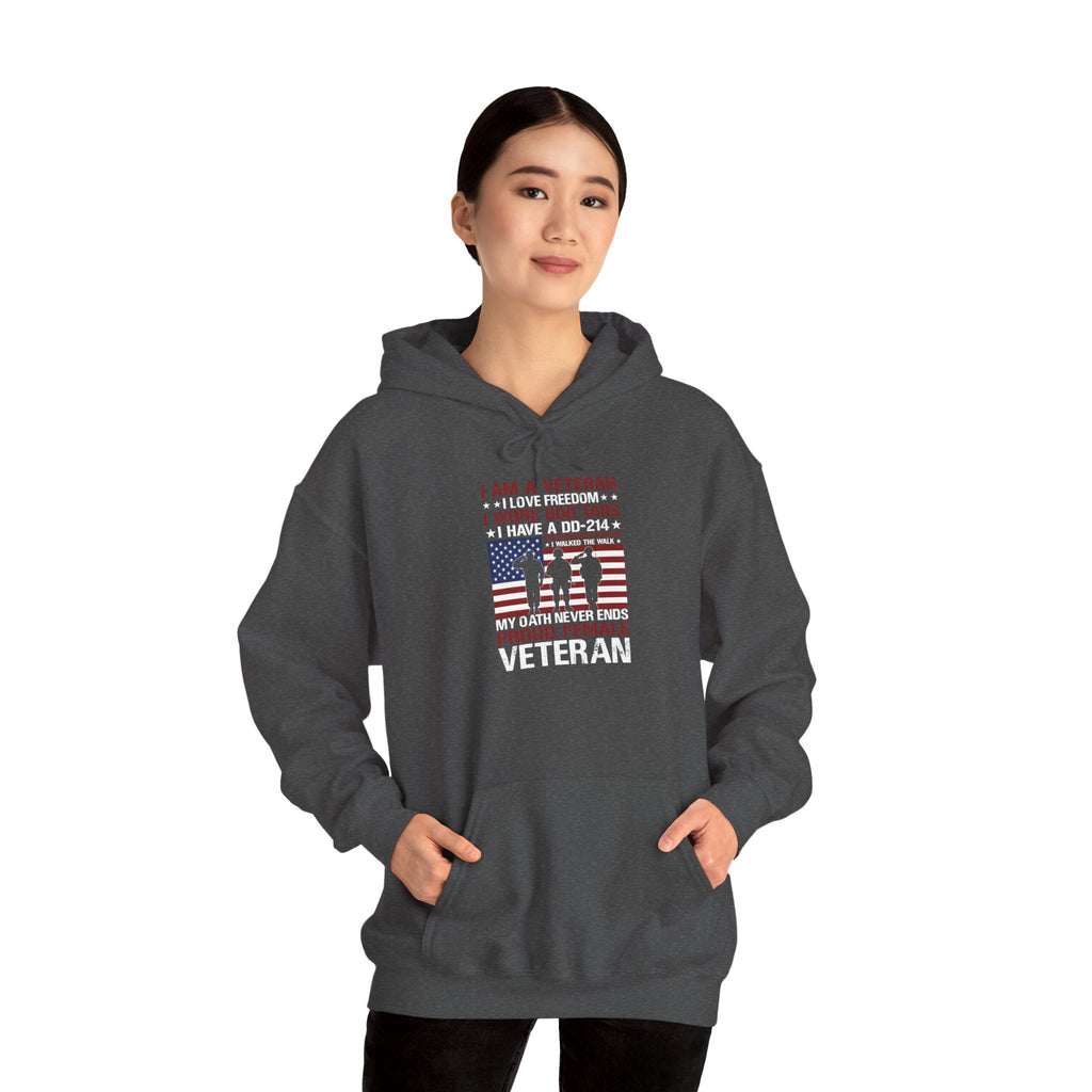Woman wearing the dark heather Proud Female Veteran My Oath Never Ends Hoodie