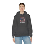 Woman wearing the dark heather Proud Female Veteran My Oath Never Ends Hoodie with jeans